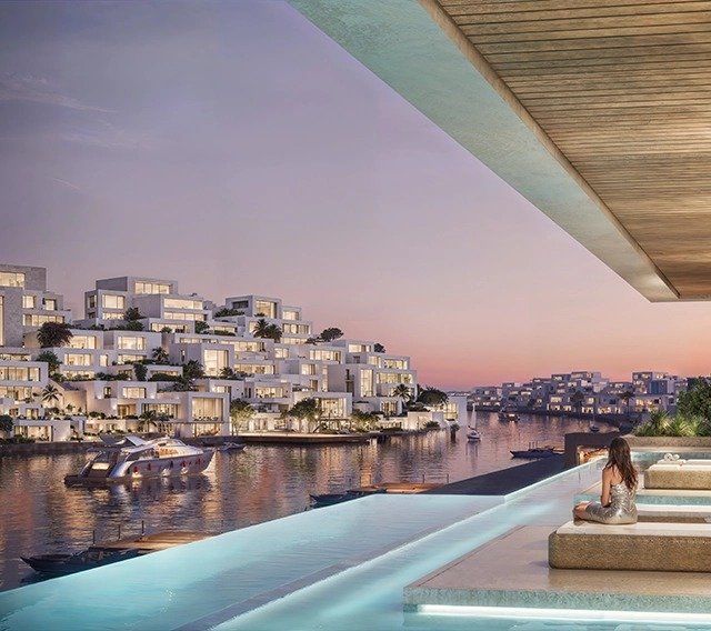 Mediterranean sunset over Parkland’s private beach, with solar-powered Cycladic-style homes blending into Ras El Hekma’s natural shoreline.